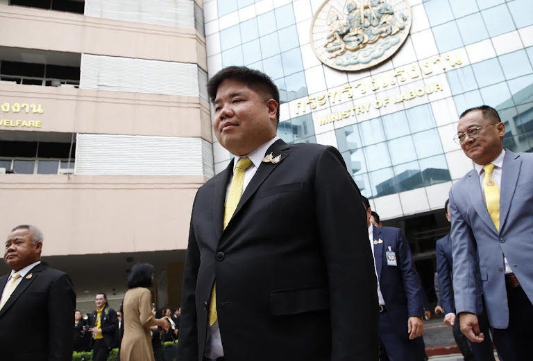 Thailand’s Labour Minister Jungrungruangkit walks confidently, unveiling policies to train workers for an AI future.