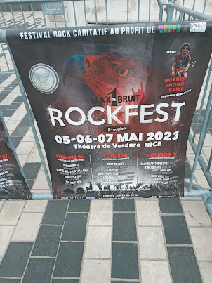 Advertisement for a Rock Festival below statue of Nike.