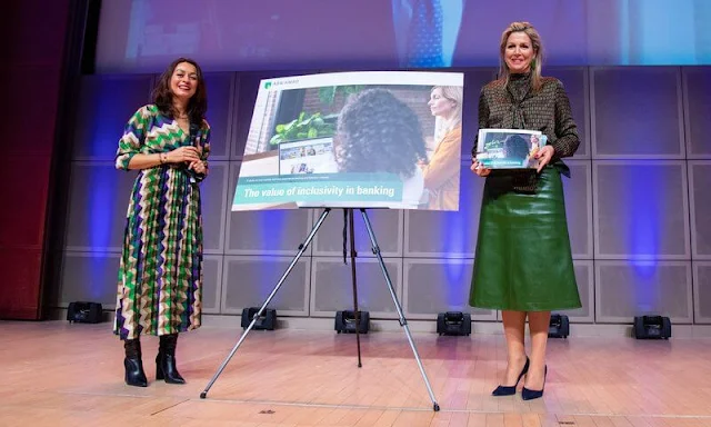 Queen Maxima wore a geometrical print viscose blouse from Natan, and a green leather skirt. Navy wool coat. Bodes and Bode earrings