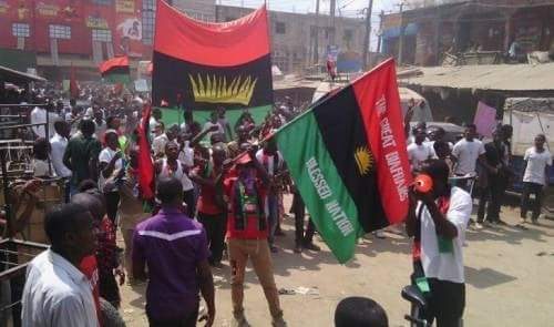 Alt: = "Protesting IPOB members holding Biafra flags"