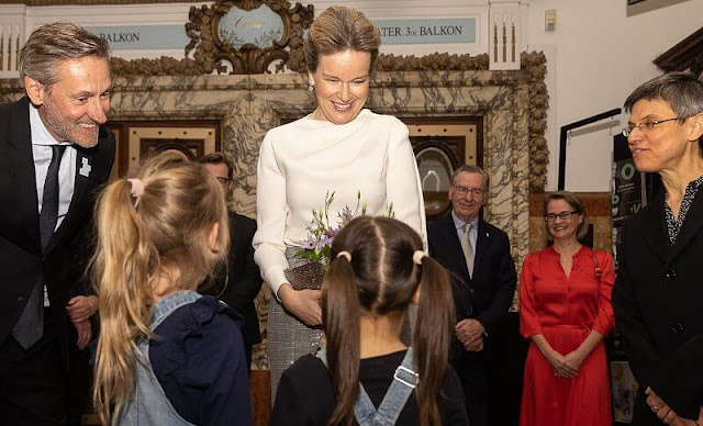 Queen Mathilde wore a silk top, blouse from Natan, and a grey silver sequin high waisted straight leg trousers from Natan