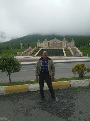 A photo shoot with Heydar Aliyev Congress center in the background on way to Gabala.