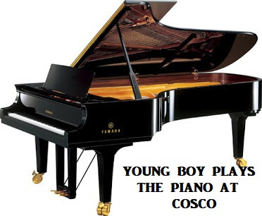 Young Boy Playing Piano At Cosco: