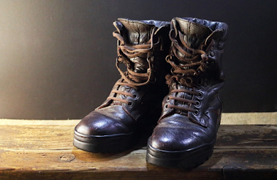 A Pair of Black Leather Combat Boots