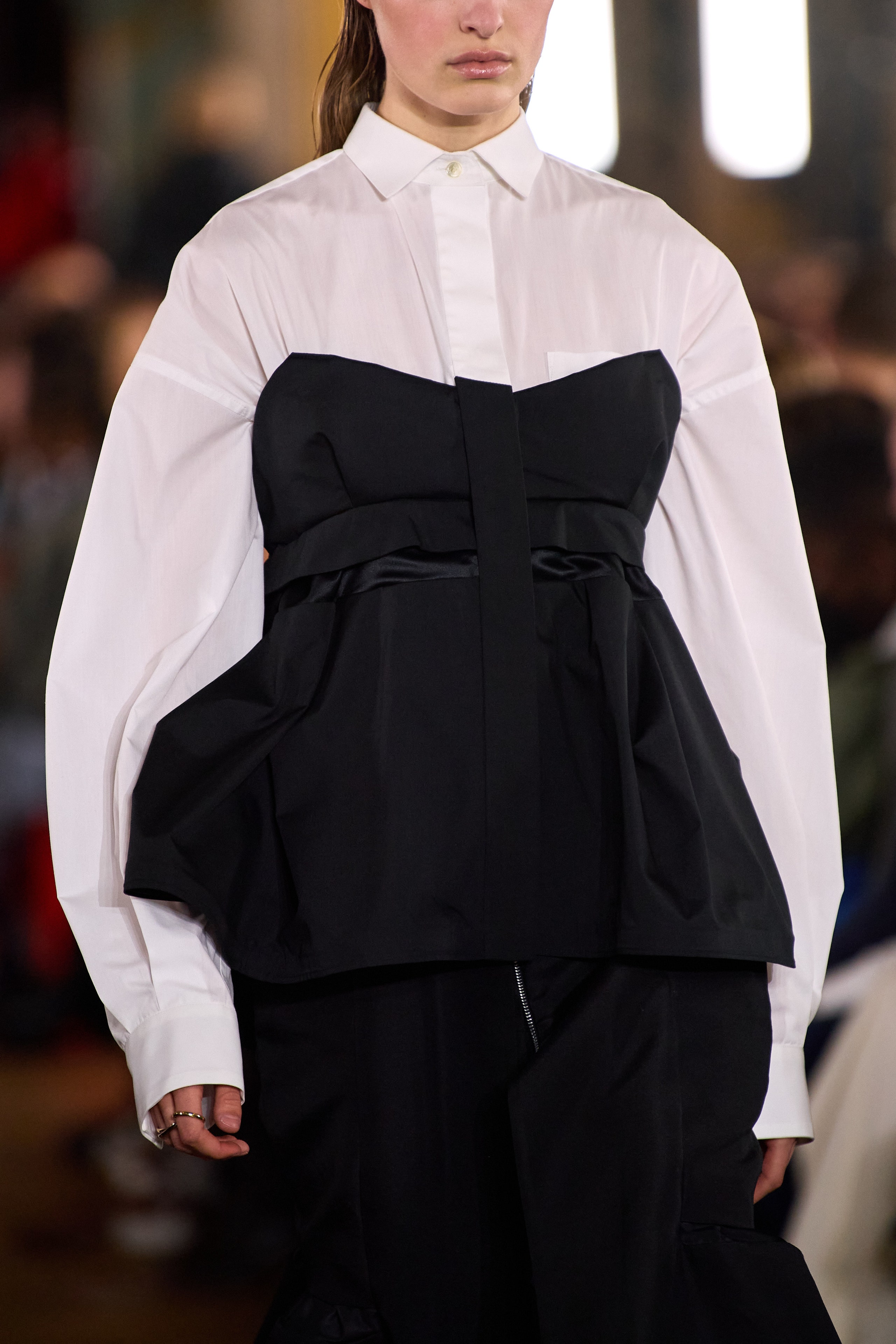 Image may contain sacai Clothing Apparel Human Person Fashion Runway dresses and Suit