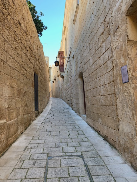 Limestone walls, narrow cobbled streets, in Mdina