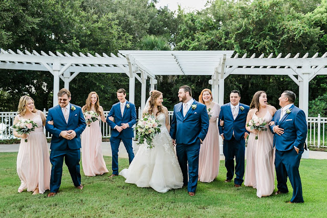bride and groom with bridal party in pink and blue