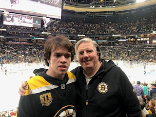 Patrick and Bob standing in front of ice rink