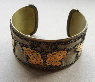 Mixed media butterfly bangle by Avon