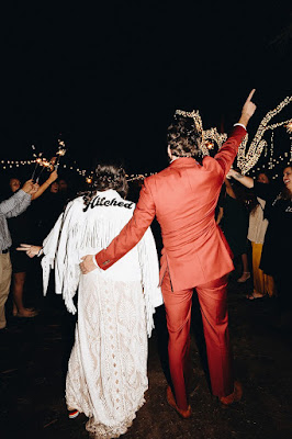 bride and groom walking away through sparkler exit