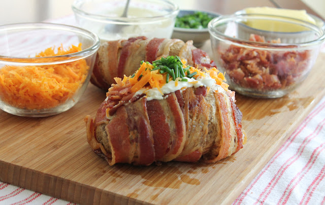 Food Lust People Love: Bacon-wrapped Loaded Baked Potatoes give bacon almost equal billing with the wonderful fluffy potato inside. Bacon-wrapped and bacon filled, they're a bacon lovers perfect baked potato. (Seriously good.)