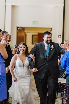 bride and groom walking and laughing