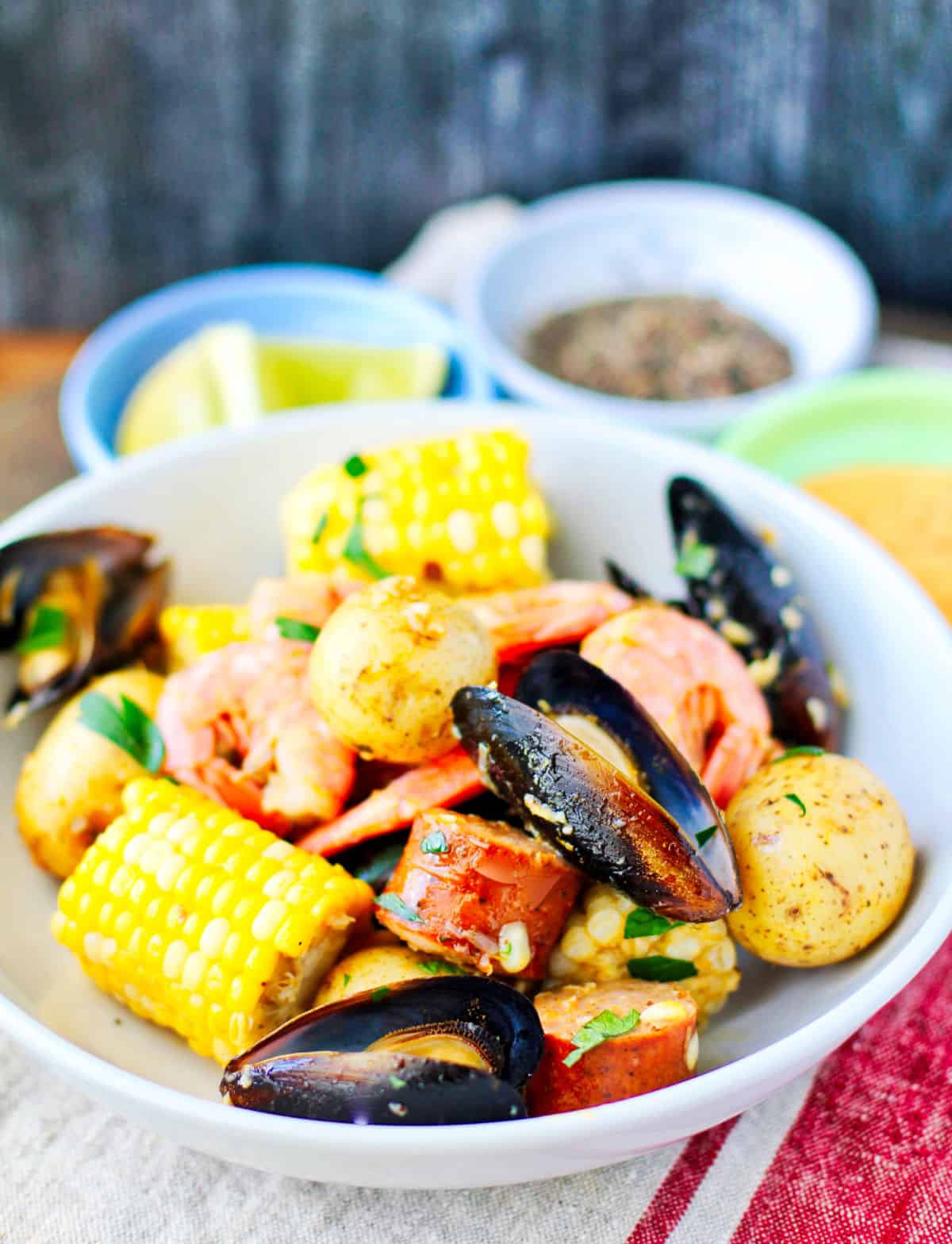 Viet-Cajun Seafood Boil in a bowl with sauces.