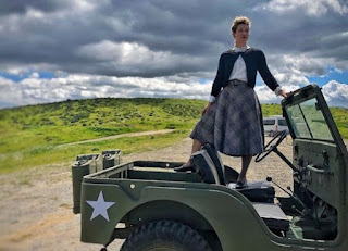 Jessie Graff posing for picture standing in a jeep