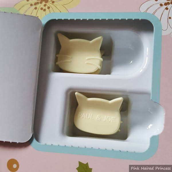 open advent door with 2 cat shaped hair clips inside