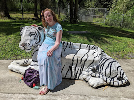 The Princess Blogger on a white tiger bench at the Pana'ewa Rainforest Zoo and Gardens