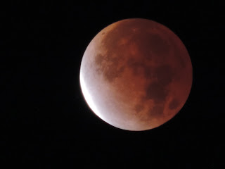 The moon glows red in a near-total eclipse