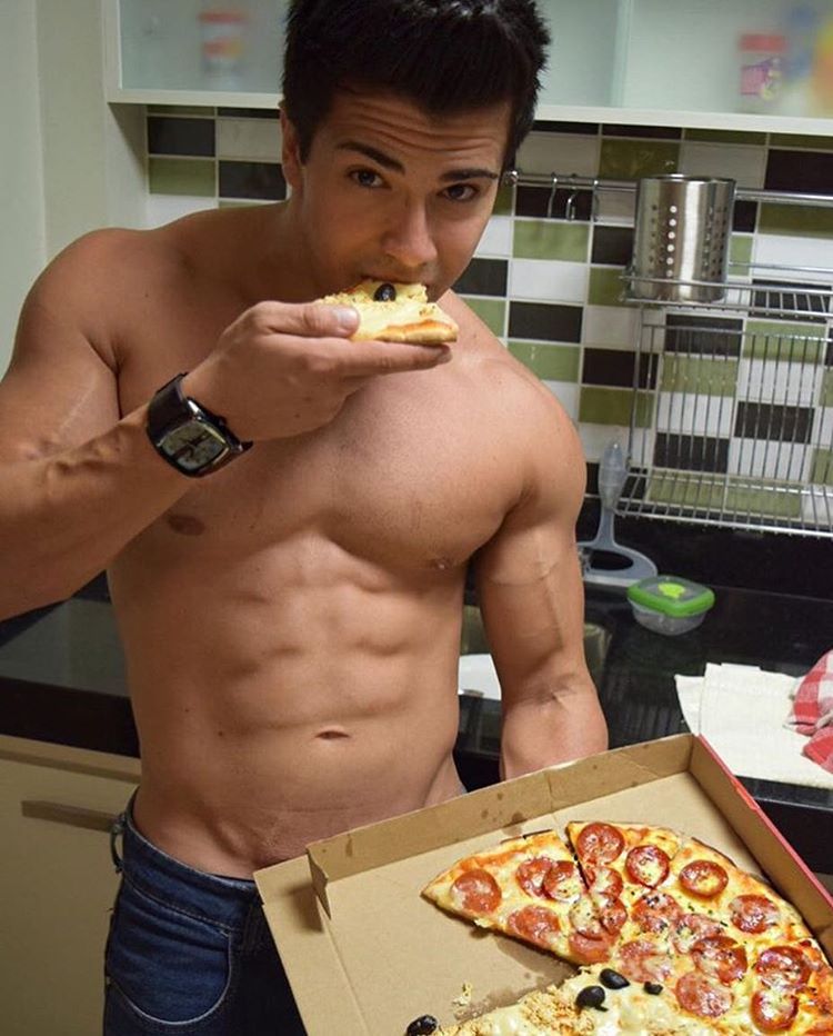 seductive-fit-shirtless-guy-eating-pizza