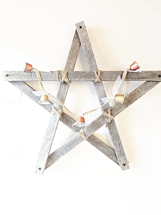 Bell garland on a wooden star