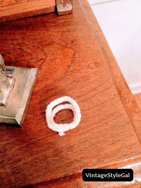 Curled pipe cleaner into a spring