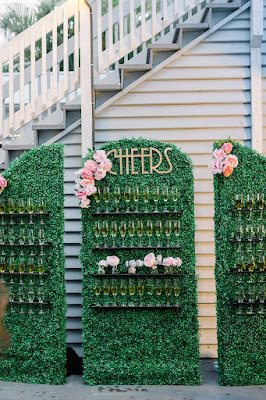 hedge wall with champagne and floral