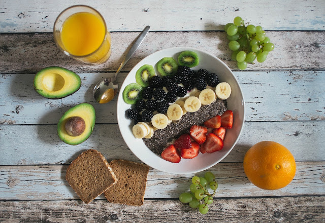 healthy food on wooden board:Photo by Jannis Brandt on Unsplash