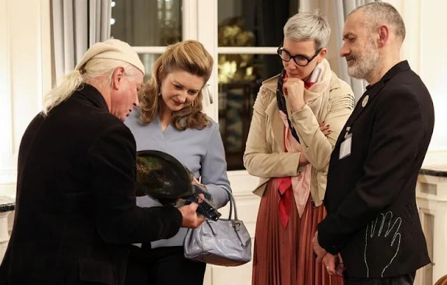 Hereditary Princess Stephanie's outfit is from Belgian fashion house Natan. Tod's satchel grey leather hobo bag. Diamond earrings