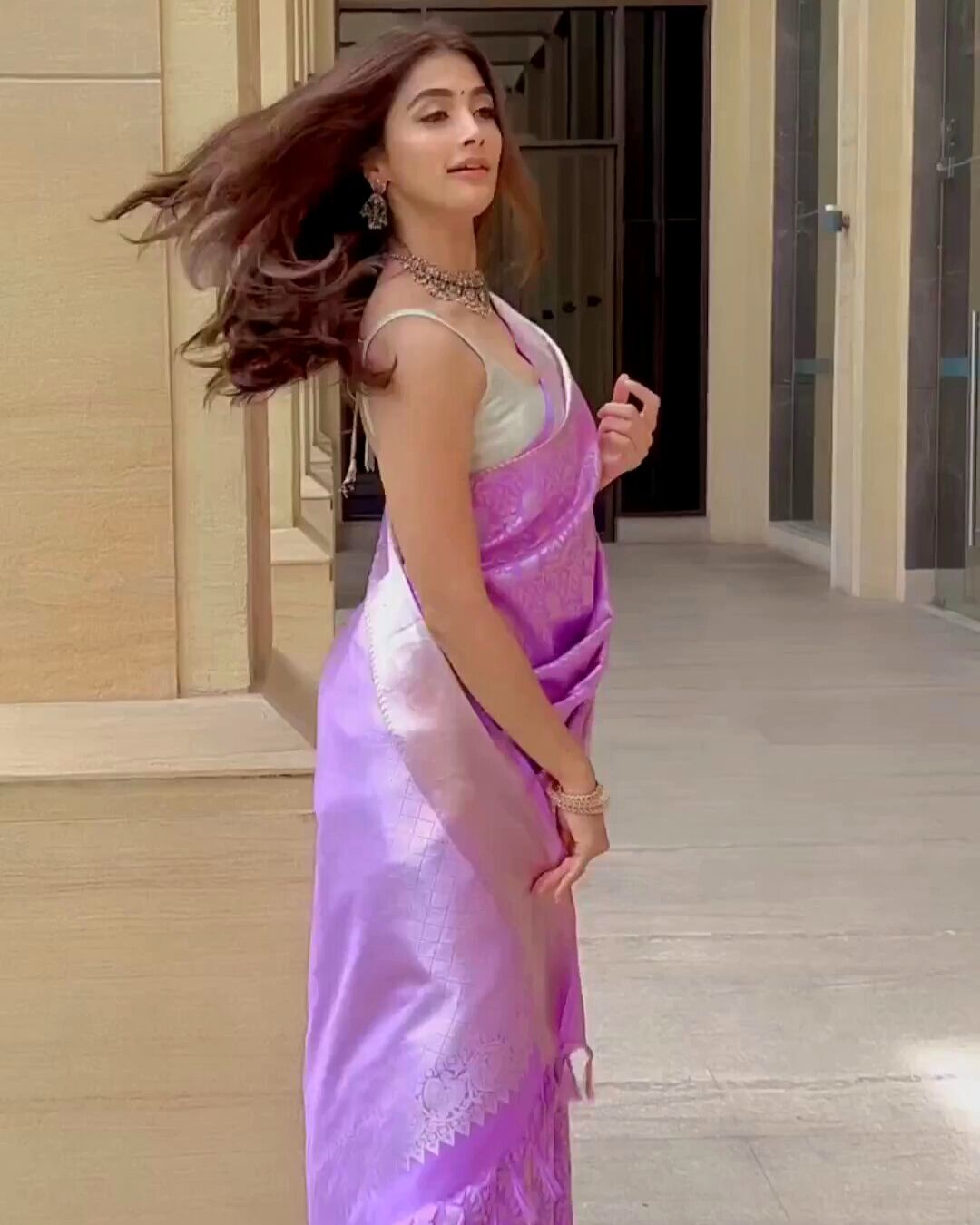 Pooja Hegde looks stunning in Purple Banarasi saree with strappy blouse