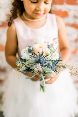 flower girl holding flowers