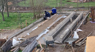 Working in the rain to fit the shuttering