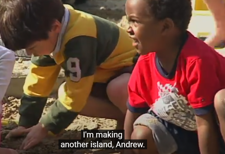 A group of children playing in the sand

AI-generated content may be incorrect.
