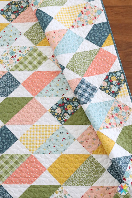 pretty crib sized quilt made from Plot Twist quilt pattern