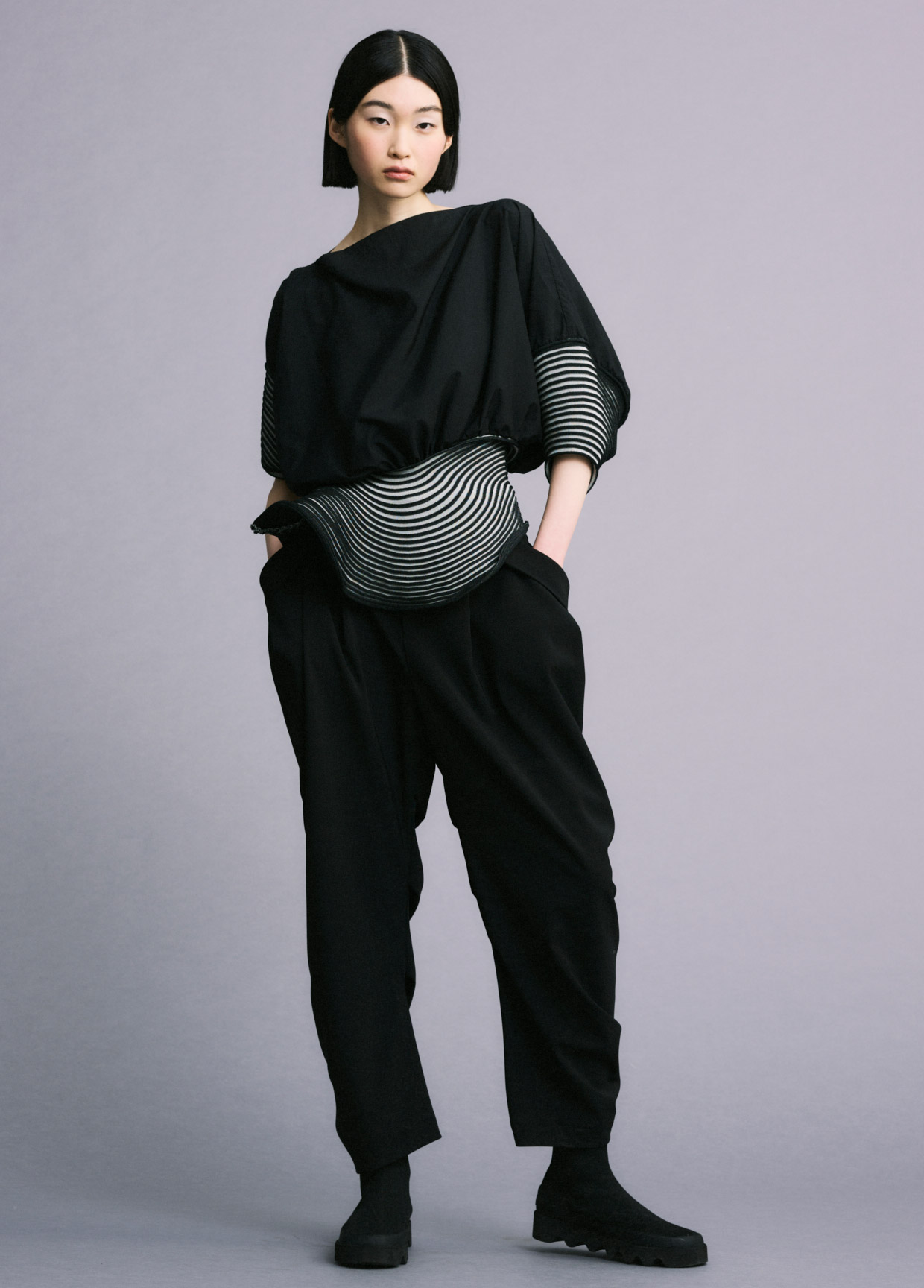 Image may contain Issey Miyake Clothing Apparel Human Person Fashion Runway Long Sleeve and Sleeve