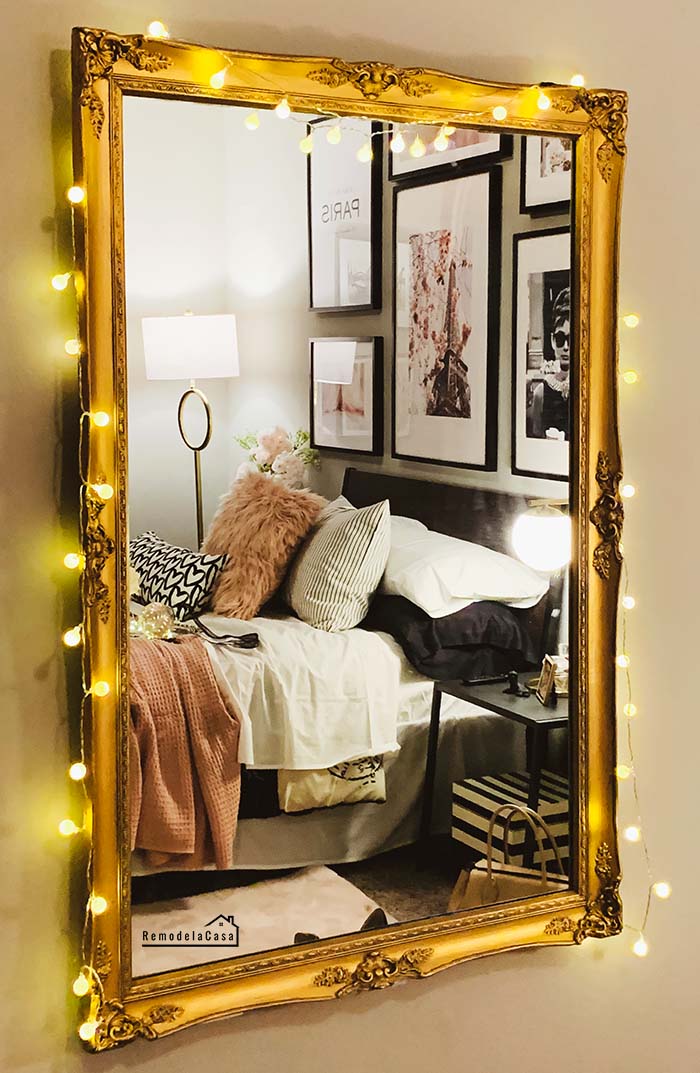 gold mirror in a Parisian bedroom