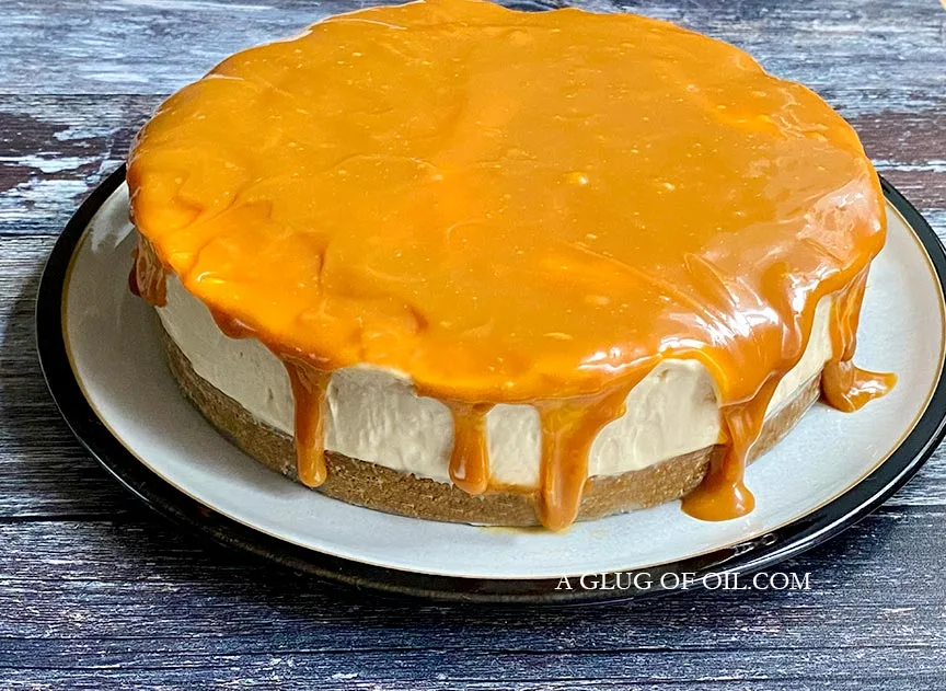 Salted Caramel Cheesecake on a serving plate. I used a no bake cheesecake recipe to make it..