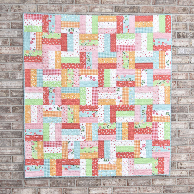 colorful quilt made using strips of fabric
