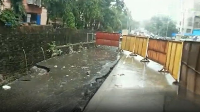In Mumbai, some of the road caves in due to heavy rains.