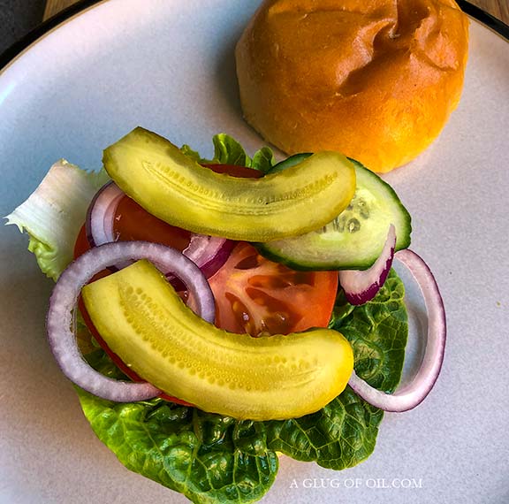 Salad and gherkins on a burger bun