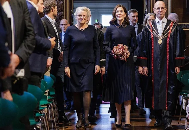 Crown Princess Mary wore a new crystal-embroidered pleated crepe midi dress by Red Valentino. Dulong Esme gold earrings