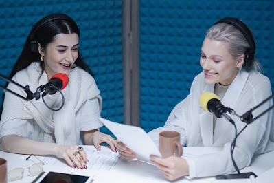 two women podcasting in a soundproof room