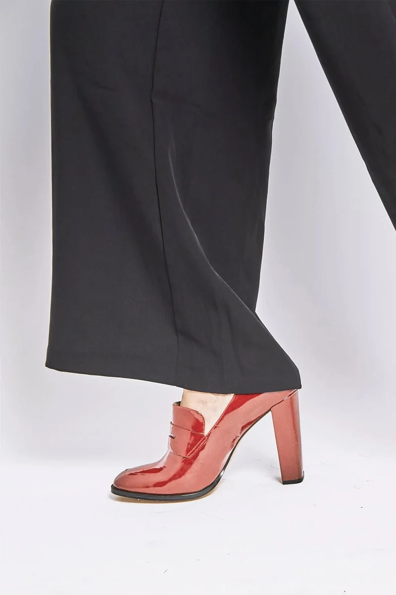 woman wearing heeled loafers