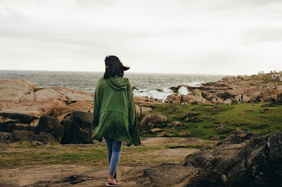 Woman walking by the sea