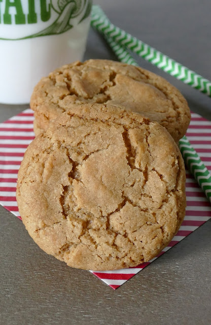 stacked cookies on a red and white striped napkin.