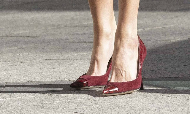 Queen Letizia wore a red dress by Carolina Herrera. Ruby earrings from Joyería Aldao 1911. New red pumps and bag by Magrit