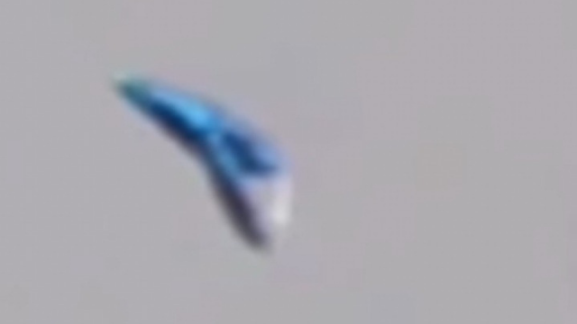 Silver UFO over London caught on camera.