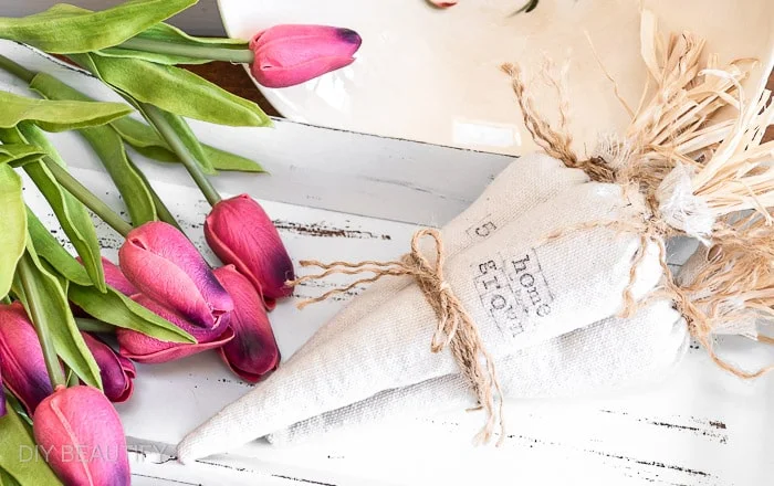 farmhouse carrot bundle in wood basket with tulips