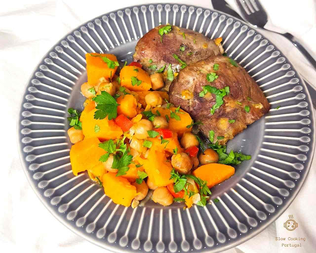 Pork stewed in a slow cooker with potatoes and chickpeas