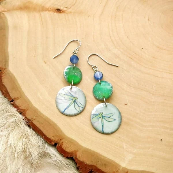 handmade paper disc dangle earrings feature dragonfly on each with smaller green and blue gemstones