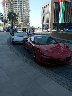 Lamborghini and Ferrari for hire. Displayed on "JBR WALK" outside "Pacific Shopping Centre"