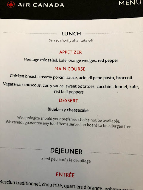 Air Canada business class food menu. Choices are vegetarian couscous or chicken